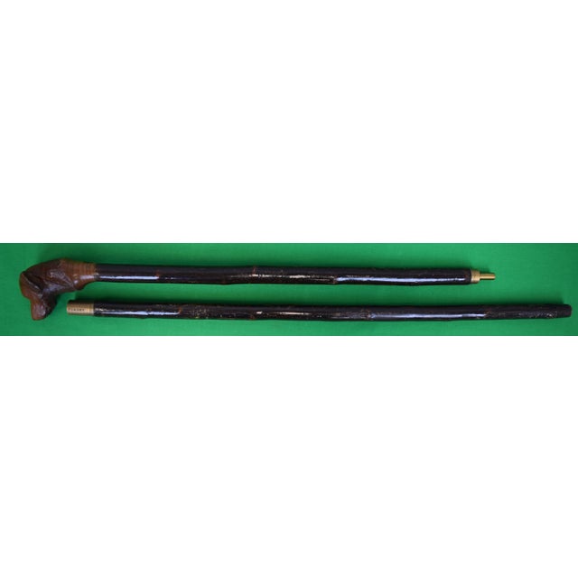 Sz: 49"L Stick unscrews in half for packing/ travel