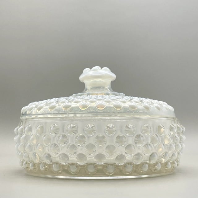 A mid 20th century hobnail lidded box in white and clear glass originally used as a vanity powder box and which is a...