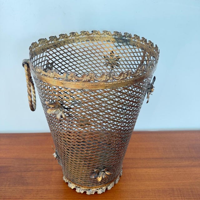 Beautiful, large, and elegant umbrella stand in Mid-Century Regency style, made of gilded metal. Made in Italy. Crafted...