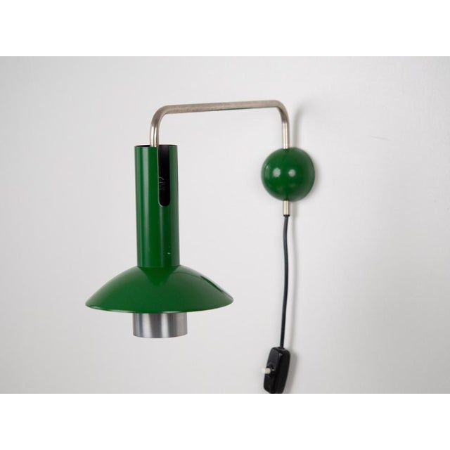 A rare Louise wall lamp in this color by Louis Poulsen. A classic example of Scandinavian mid-century modern design. The...