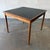 A vintage Danish rosewood game table by Poul Hundevad, dating to the 1960s. The removable square top can be reversed, with...
