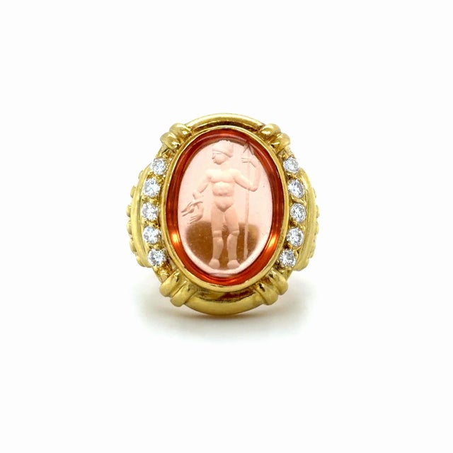 This stunning ring designed by Judith Ripka in a Roman revival style is centered around one oval citrine intaglio...