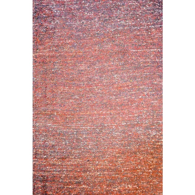 A fantastic vintage Persian Gabbeh Kilim rug woven in crimson and indigo wool with a simple whipstitched edge trim.