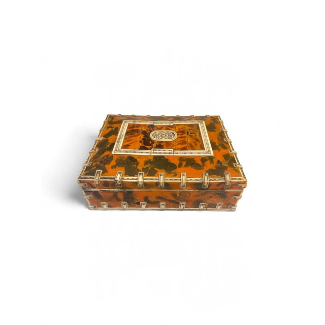 This exceptional 19th-century Anglo-Indian jewelry box is a stunning example of Vizagapatam craftsmanship from the British...