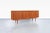 Designed by Axel Christensen for ACO Mobler in Denmark during the 1960s, this Danish modern teak credenza exemplifies the...