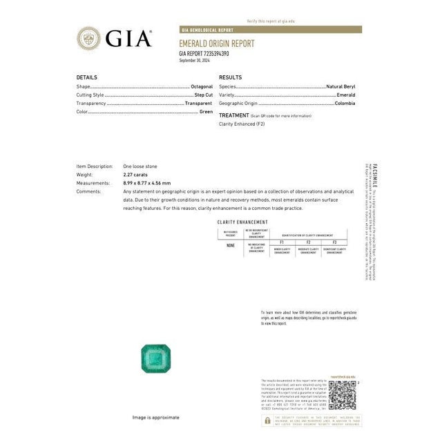 A GIA-certified Colombian emerald shines in a pure, vivid green at the heart of this solid 14K white gold ring, framed by...