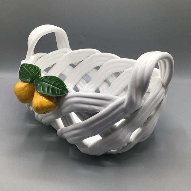Very nice vintage hand woven and hand decorated centerpiece fruit basket. This oblong fruit basket has two pears and two...