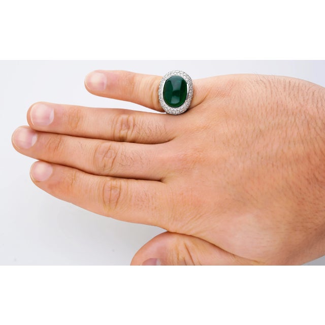 18K white gold multi-gemstone cluster cocktail ring. Featuring a 10.12 carat cabochon cut minor oil African emerald and...