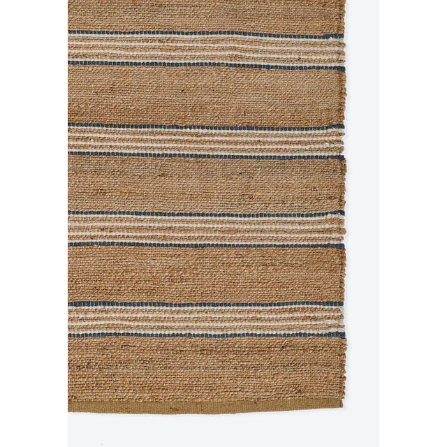 A different take on a simple stripe style, this tightly handwoven natural jute and wool rug is the modern marvel your...