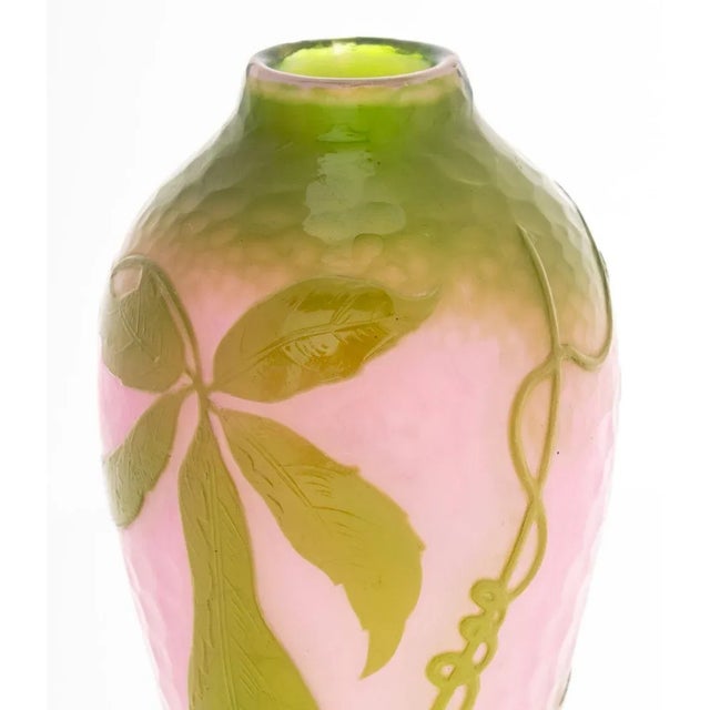 Daum Nancy Martele Ovoid Glass Vase, circa 1919-1923, the pink ground with chartreuse overlay and cameo cut berries and...