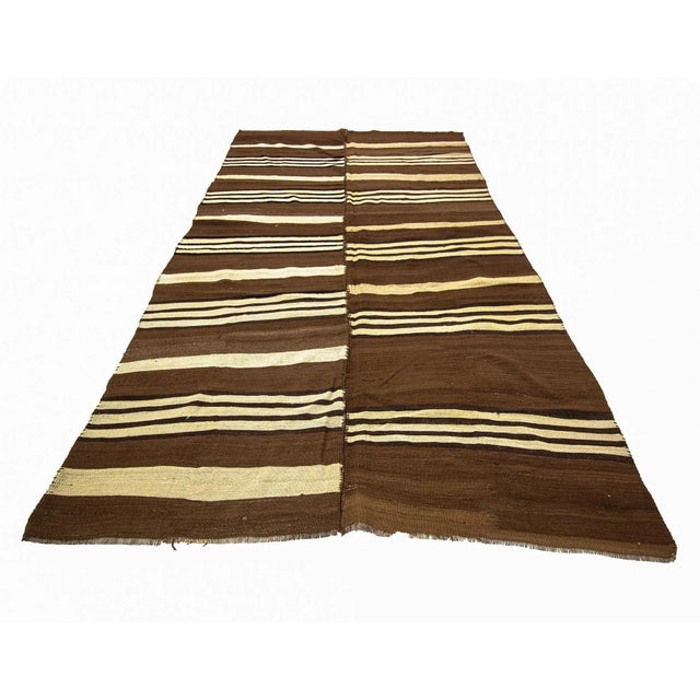 Vintage hand woven striped wool Kilim rug from Kars region of Turkey. Approximately 50-60 years old. In very good condition