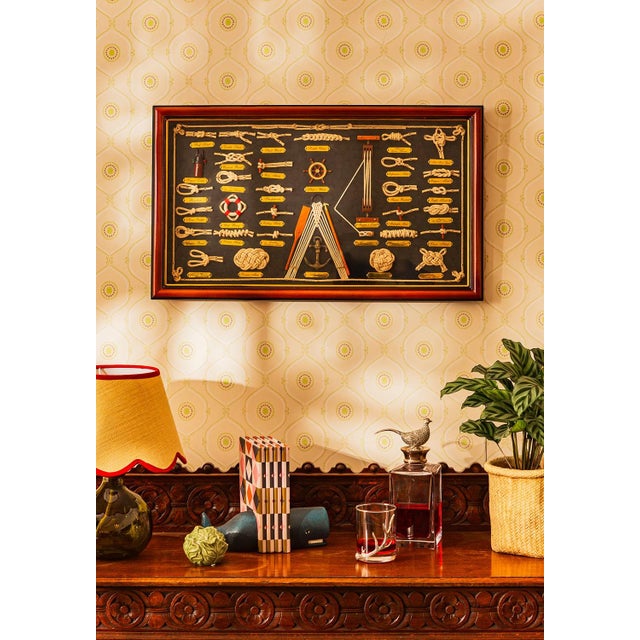 This comprehensive shadowbox display showcases an array of nautical knots and rope work, featuring various types of...