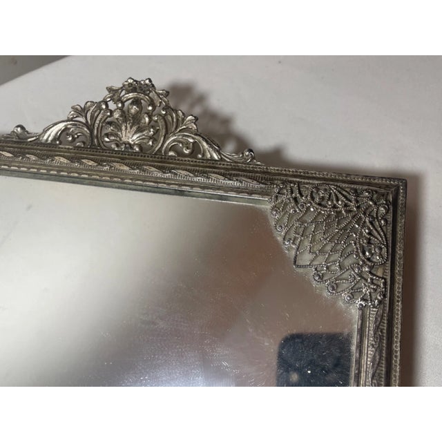 Up for sale is a wonderful antique rectangular silver-plated vanity table top mirror tray. It has a very ornate filigree...