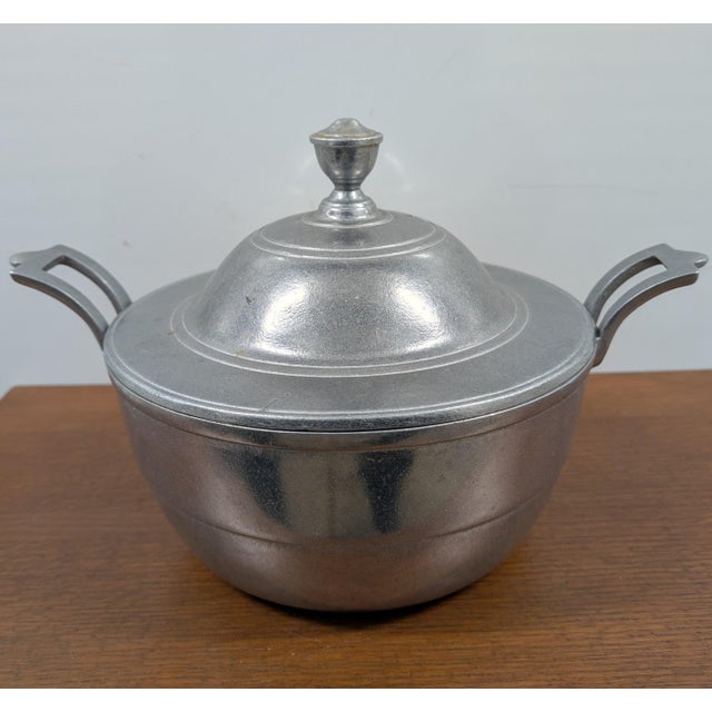 Add a touch of Mid-Century Colonial charm to your table with this vintage 1960s Wilton Armetale soup tureen, complete with...