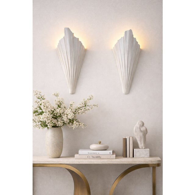 A striking pair of Art Deco wall sconces inspired by the sculptural form of the Bismarck Palm (Silver Bismarck Palm),...
