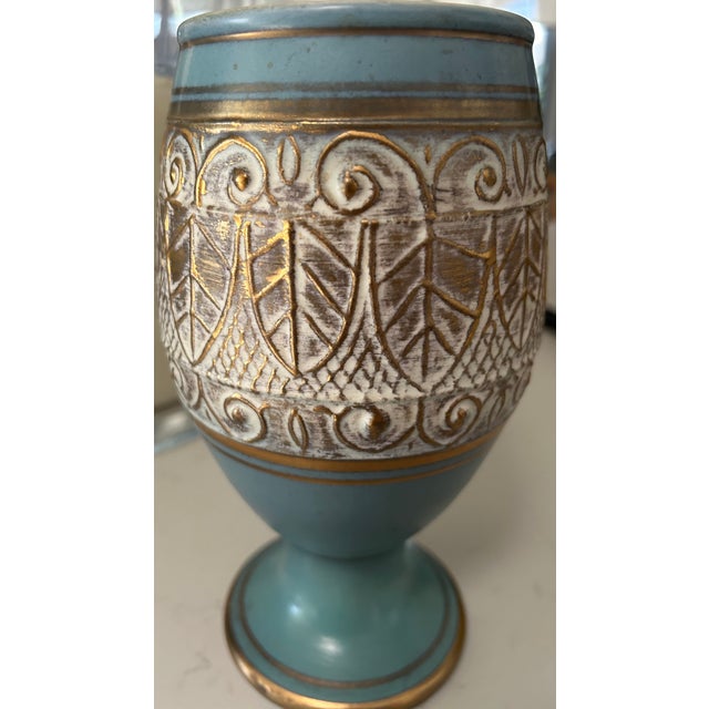 This regal vintage chalice/vase is hand decorated in sky blue, gold, and white by renowned California artisan Vee...