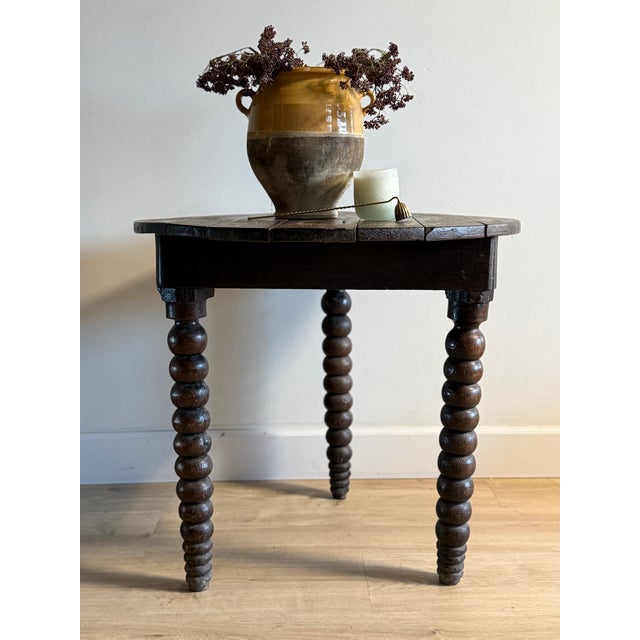 This antique French bobbin table is a quietly compelling study in age, material, and use. The base dates to the 18th...