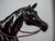 A beautiful, large sculpture of a jockey on horseback. Detailed execution. The sculpture is signed on the base. It was...