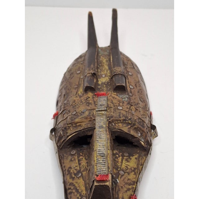 This is a hand-carved ritual mask originating from the Marka (Winiama) people of Mali. Measuring approximately 11 inches...