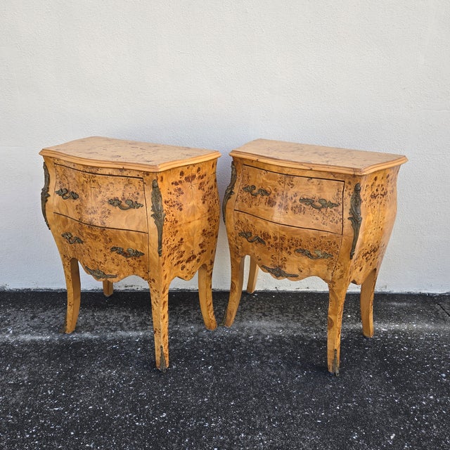 This vintage pair of bombe chests stand out, covered top to bottom in a book matched birdseye maple wood veneer! Each...