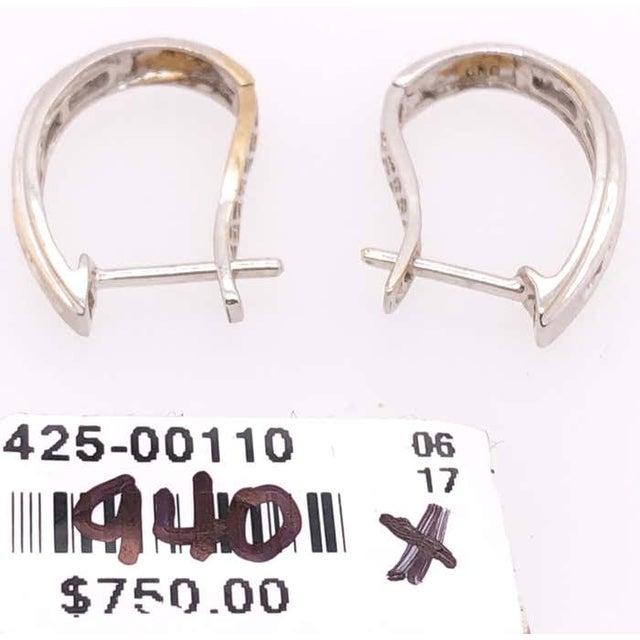14 Karat White Gold Latch Back Earrings with Round Diamonds. 0.50 total diamond weight. 1.65 grams total weight.