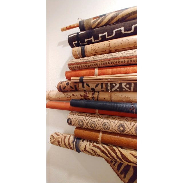 An assemblage created from cylinder shapes of mostly natural elements ~ inspired by Africa. Materials are rolls of:...