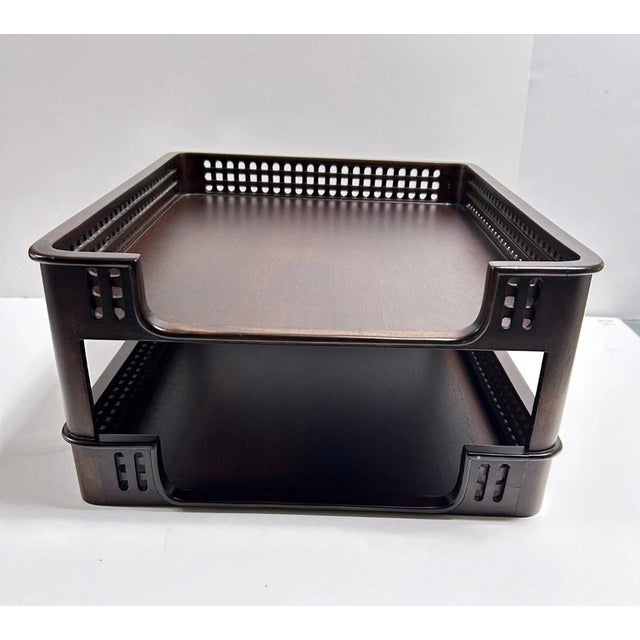 A handsome two-tier mahogany desk tray by Selamat Designs featuring pierced lattice gallery sides and a clean...