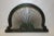 Our decorative wooden arch has a unique harp shape. This piece features symmetrical iron bars that fan out around an...
