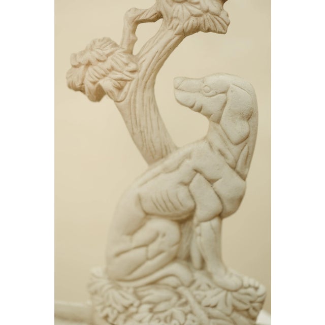 A piece with quiet charm and timeless presence. This cast iron umbrella stand features a sculptural dog seated beneath a...