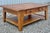 Rustic farmhouse style abounds in this solid oak coffee table by Broyhill from their very popular Attic Heirlooms...