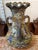 This is an Early 20th Century Japanese Moriage Porcelain Triple Handled Vase. It measures 12" tall and 8" in diameter. The...