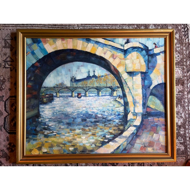Beautiful vintage 1975 Paris School oil painting depicting a picturesque view of the Seine River through the historic...