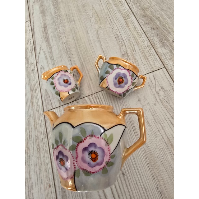 Add a charming splash of mid-century nostalgia to your shelf arrangement or doll collection with this vintage 3-piece...