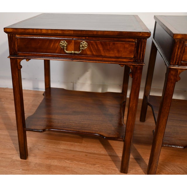 We are pleased to offer this beautiful pair of English Regency side tables, from the 1930s. This Pair is made of Mahogany...