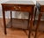 We are pleased to offer this beautiful pair of English Regency side tables, from the 1930s. This Pair is made of Mahogany...