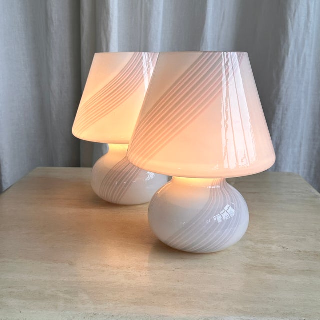 Beautiful swirl Murano glass set of table lamps by Maestri Muranesi. The legendary swirl pattern and mushroom shape with a...
