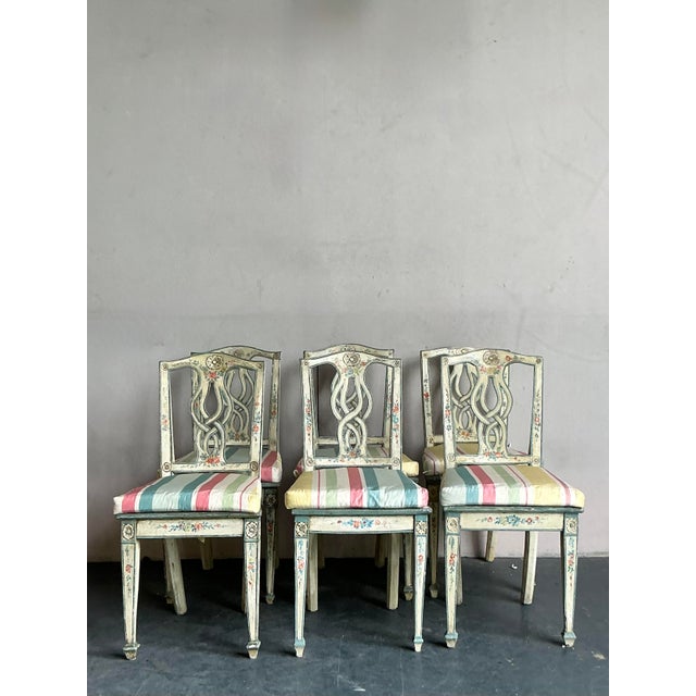 Infuse your dining space with romantic, old-world artistry with this exquisite set of six vintage dining chairs....