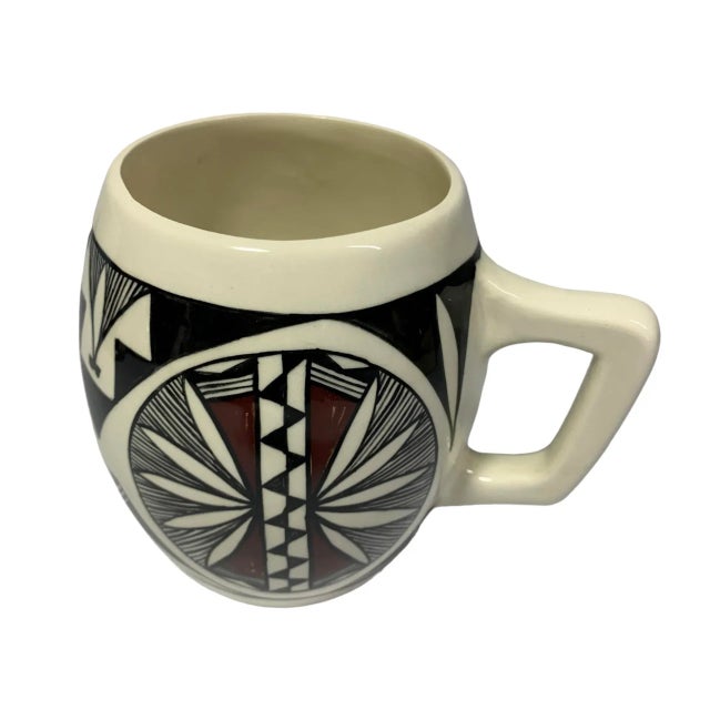 Rich example of the artistry of Acoma Pueblo Pottery, signed "Acoma N Mex CH." Hand-painted in rich tones of brown and...