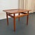 This Scandinavian Modern teak side table was designed by the Danish furniture designer Grete Jalk for Glostrup Møbelfabrik...