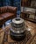 This exquisite coffee table is a harmonious fusion of a centered jet turbine and a meticulously crafted glass piece. Its...