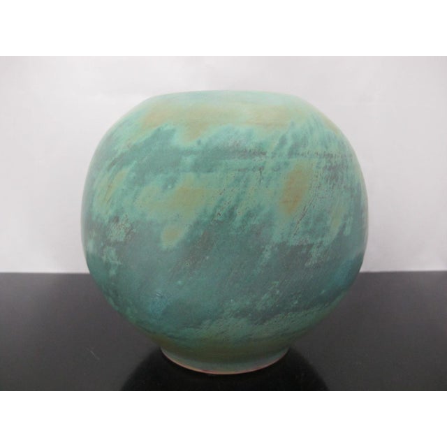 Rustic, bohemian in style studio pottery vase. Bulbous, spherical shape with a small base. Lovely earth tones of mottled...