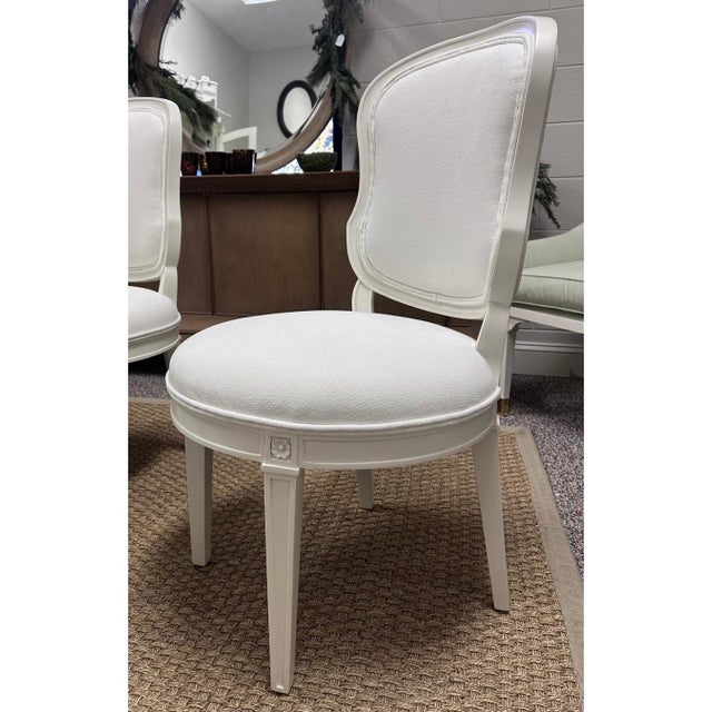 These elegant Louis XVI-style dining chairs feature timeless neoclassical design with a softly contoured back and classic...