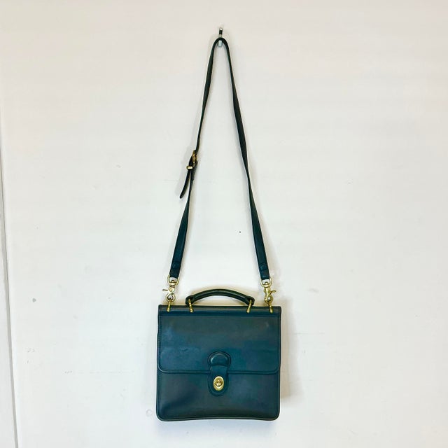 We love a satchel and this vintage Coach Navy Leather Willis Handbag has a 44” strap so it’s also a beloved Crossbody...
