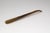 A prime example of elevating an everyday object: this generously proportioned shoehorn from the 1940s or 1950s captivates...