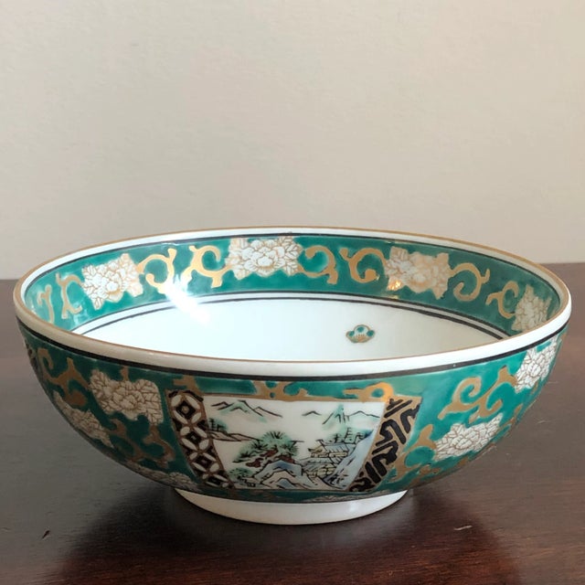 Offering a small, brightly-colored and hand-painted porcelain Imari bowl from the mid-20th century. Handcrafted in Japan....