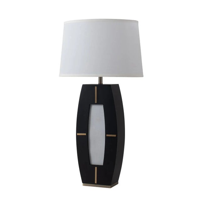 Illuminate your space with the Delacey Table Lamp by Nova of California, a testament to mid-century modern design. The...