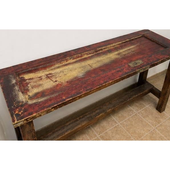 Unique reclaimed console / bar-height table crafted from an authentic antique wood door. The tabletop features the...