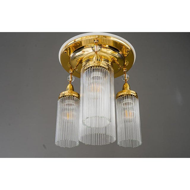 Brass polished and stove enameled The glass sticks are replaced ( new ) Wood plate white lacquered Up to 250V (Europe/UK...