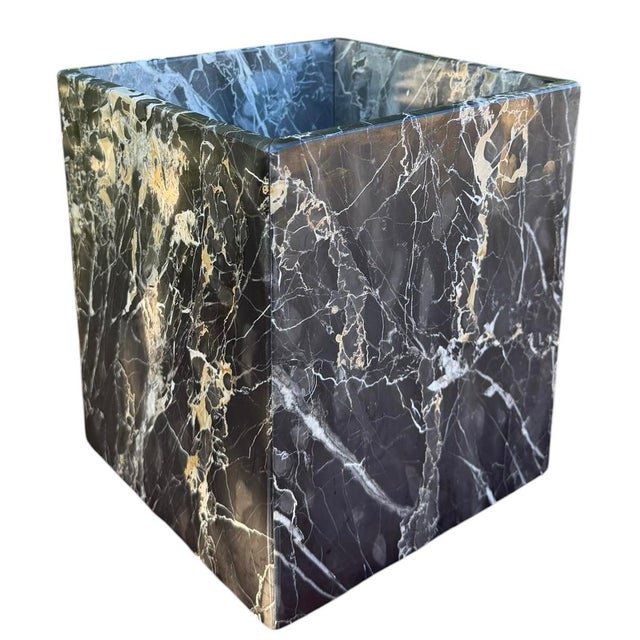 A substantial vintage Labrazel cachepot handcrafted in Italy from richly veined black marble with dramatic white and warm...