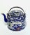 A very rare Chinese porcelain teapot with intricate hand painted scenes in rich enamels against a rare blue glaze. The...